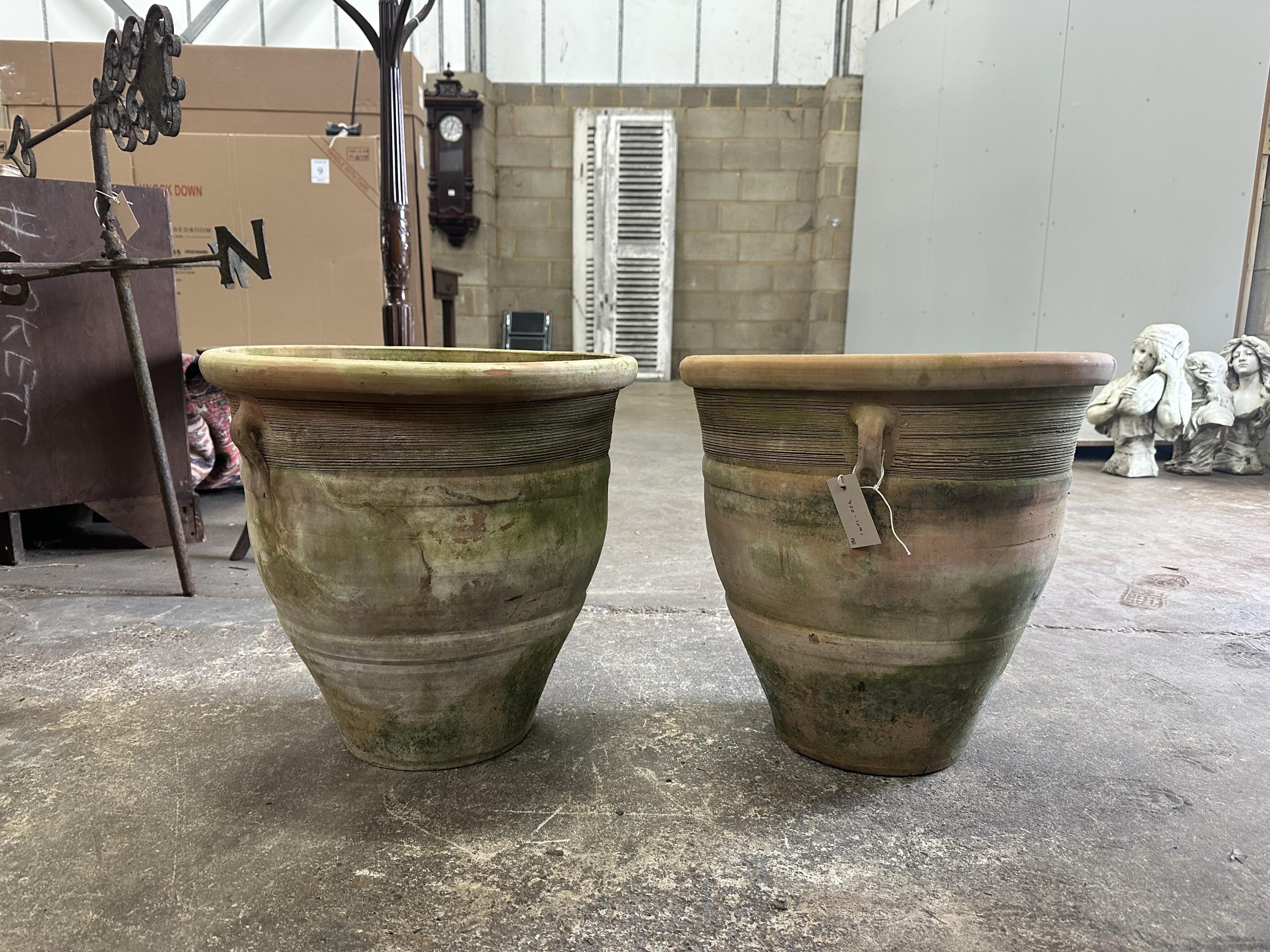 A pair of terracotta planters, diameter 46cm, height 45cm. Condition - fair to good